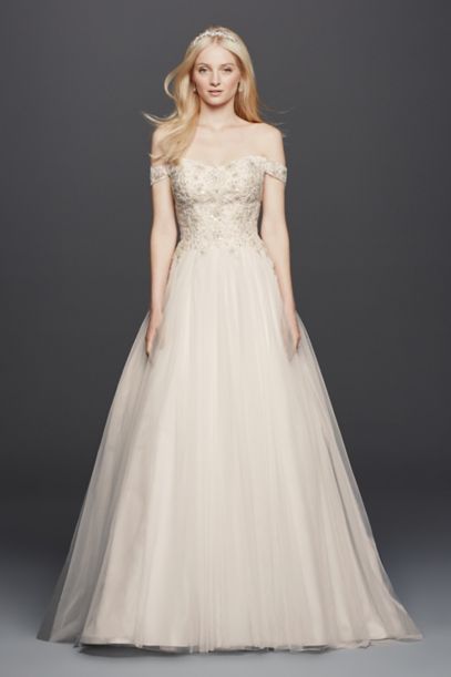 Off-the-shoulder swag sleeves add romance to this classic ball gown wedding dress with a sweetheart neckline and scoop illusion back. Mother-of-pearl beading ad